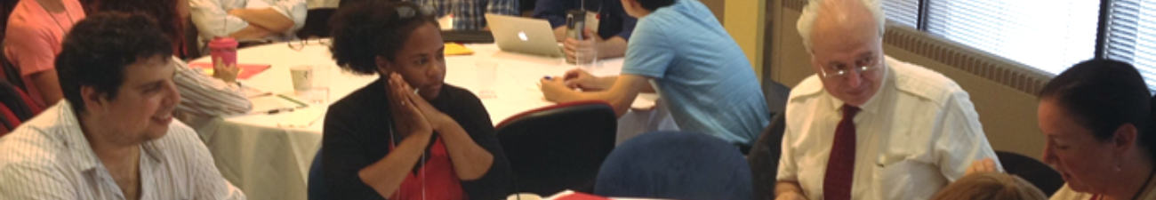 Faculty talking around table